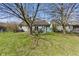 Lovely backyard features a deck, mature trees, and well-maintained lawn at 10875 Santa Anita Ct, Carmel, IN 46280