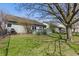 Private backyard with a deck, green grass, and partial fence at 10875 Santa Anita Ct, Carmel, IN 46280