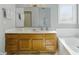 Spacious bathroom features vanity with ample storage and large mirror at 10875 Santa Anita Ct, Carmel, IN 46280