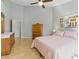 Comfortable bedroom with wooden floors and furnishings, including an armoire at 10875 Santa Anita Ct, Carmel, IN 46280