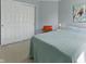 Bedroom with neutral paint, carpet, simple furnishings, sliding closet doors, and natural light at 10875 Santa Anita Ct, Carmel, IN 46280
