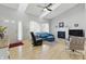 Open-concept living room featuring vaulted ceilings, a fireplace, and seamless access to the front entry at 10875 Santa Anita Ct, Carmel, IN 46280