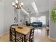 Bright living room offering an open floor plan, seamlessly connected to the dining area at 10875 Santa Anita Ct, Carmel, IN 46280