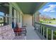 Inviting front porch with comfortable seating, offering a pleasant outdoor living space at 10875 Santa Anita Ct, Carmel, IN 46280