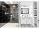 Stylish bathroom featuring a walk-in shower with tiled walls and a double sink vanity at 1107 Leisure Ln, Greenwood, IN 46142
