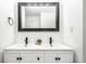Contemporary bathroom vanity with dual sinks, a large mirror, and modern black hardware at 1107 Leisure Ln, Greenwood, IN 46142