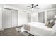 Light-filled bedroom with plush carpet and a modern ceiling fan at 1107 Leisure Ln, Greenwood, IN 46142
