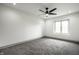 Spacious bedroom with plush carpet, recessed lighting, and a bright window at 1107 Leisure Ln, Greenwood, IN 46142