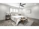 Bright bedroom featuring a comfortable bed, two side tables with lamps and large window at 1107 Leisure Ln, Greenwood, IN 46142