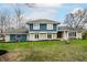 Charming two-story home with blue and stone exterior and well-maintained front yard at 1107 Leisure Ln, Greenwood, IN 46142