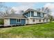 Beautiful two-story home with blue and stone exterior and lush green lawn at 1107 Leisure Ln, Greenwood, IN 46142
