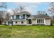 Inviting two-story home featuring blue and stone exterior with a well-kept lawn at 1107 Leisure Ln, Greenwood, IN 46142