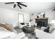 Living room with cozy fireplace, modern decor, and comfortable seating at 1107 Leisure Ln, Greenwood, IN 46142