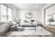 Bright living room with large windows, light-colored walls, and hardwood floors at 1107 Leisure Ln, Greenwood, IN 46142