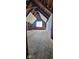 Attic under construction, showcasing exposed rafters and natural light from a central window at 116 N Vine St, Shelbyville, IN 46176