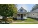 Charming two-story home with a classic architectural style and a well-maintained front yard at 116 N Vine St, Shelbyville, IN 46176
