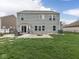 Charming backyard featuring a patio with fire pit, grill, and outdoor seating, perfect for entertaining at 1232 Blue Haven Way, Greenwood, IN 46143