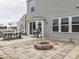 Relaxing backyard with a cozy patio, fire pit, and outdoor dining area at 1232 Blue Haven Way, Greenwood, IN 46143