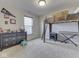 Bedroom with a loft bed, desk, and natural light creating a versatile space at 1232 Blue Haven Way, Greenwood, IN 46143