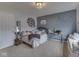 Cozy bedroom with carpeted floors, a large bed, and a decorated gray accent wall at 1232 Blue Haven Way, Greenwood, IN 46143