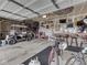 Spacious garage with a golf cart, bikes, a bar, and ample storage at 1232 Blue Haven Way, Greenwood, IN 46143