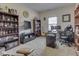 Well-lit home office with shelving and comfortable office chair at 1232 Blue Haven Way, Greenwood, IN 46143