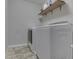 Laundry room featuring a side-by-side washer and dryer, tiled floor, and shelving at 1232 Blue Haven Way, Greenwood, IN 46143