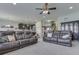 Expansive living area flows into the kitchen, with ample seating and stylish lighting fixtures at 1232 Blue Haven Way, Greenwood, IN 46143