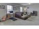 Comfortable living room featuring carpet flooring and an adjacent home office setup at 1232 Blue Haven Way, Greenwood, IN 46143