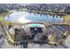 Aerial view of community pool, clubhouse, pond, and surrounding neighborhood at 13107 Pennington Rd, Fishers, IN 46037