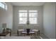 Bedroom featuring a sitting area with two accent chairs and a table in front of a window at 13107 Pennington Rd, Fishers, IN 46037