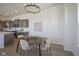 Bright dining area with views of the kitchen and lots of natural light at 13107 Pennington Rd, Fishers, IN 46037
