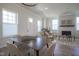 Bright dining area with views of the fireplace in the living room at 13107 Pennington Rd, Fishers, IN 46037
