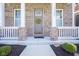 Close-up of front door and address, showing brick columns and fresh landscaping at 13107 Pennington Rd, Fishers, IN 46037