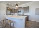 Modern kitchen boasts a large island, stainless appliances, and stylish pendant lighting at 13107 Pennington Rd, Fishers, IN 46037