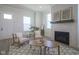 Inviting living room features a tiled fireplace, cozy seating, and neutral decor at 13107 Pennington Rd, Fishers, IN 46037