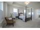 Main bedroom with four-poster bed, chair, carpet and multiple windows at 13107 Pennington Rd, Fishers, IN 46037