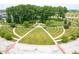 Aerial view of a park with walking paths, trees, and green space on a sunny day at 13107 Pennington Rd, Fishers, IN 46037