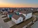 Aerial view of a vibrant neighborhood showcasing colorful homes, well-maintained lawns, and community appeal at 1401 Farmhouse Dr, Westfield, IN 46074