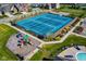 Aerial view showcases a tennis court, playground, and community pool, fostering an active lifestyle at 1401 Farmhouse Dr, Westfield, IN 46074