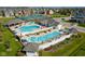 Aerial view showcases community pools, sun loungers, recreational facilities, and manicured landscaping at 1401 Farmhouse Dr, Westfield, IN 46074