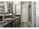 Elegant bathroom with double sinks, granite countertops, dark cabinets, and tiled floors at 1401 Farmhouse Dr, Westfield, IN 46074