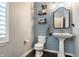 Charming powder room with a pedestal sink, shiplap wall, and neutral decor at 1401 Farmhouse Dr, Westfield, IN 46074