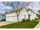 Charming two-story home with attached garage, a well-manicured lawn and beautiful landscaping at 1401 Farmhouse Dr, Westfield, IN 46074