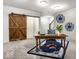 Bright home office featuring natural light, carpet, and a wooden door with decorative accents at 1401 Farmhouse Dr, Westfield, IN 46074