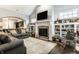 Open living space with a cozy fireplace, built-in bookshelves, and comfortable seating at 1401 Farmhouse Dr, Westfield, IN 46074