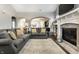 Spacious living area with an open floor plan, modern fireplace, and comfortable seating at 1401 Farmhouse Dr, Westfield, IN 46074