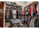 Well-organized walk-in closet with shelving, hanging racks, and a variety of clothing and shoe storage options at 1401 Farmhouse Dr, Westfield, IN 46074