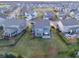 Aerial view of homes in a neighborhood with green lawns, patios, and lush landscaping at 14059 Knightstown E Dr, Carmel, IN 46033
