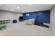 Finished basement featuring neutral decor, seating, TV, and exercise equipment at 14059 Knightstown E Dr, Carmel, IN 46033